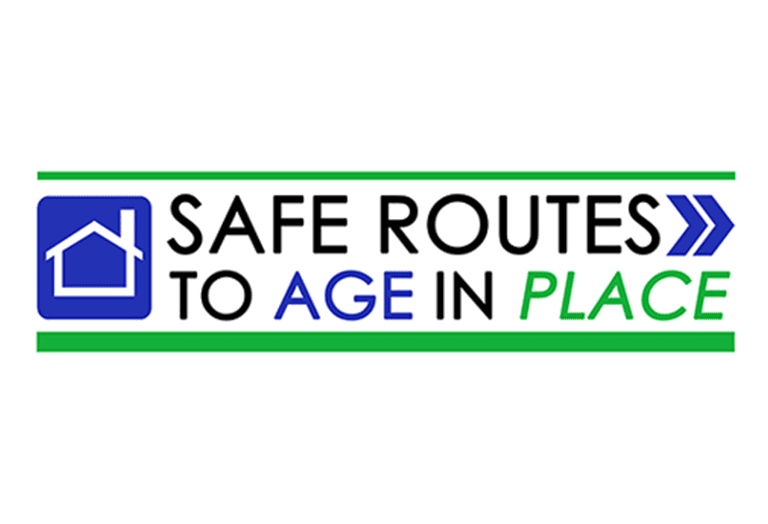 A sign that says safe routes to age in place.