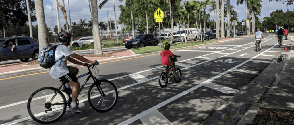 two cyclists in a bike lane